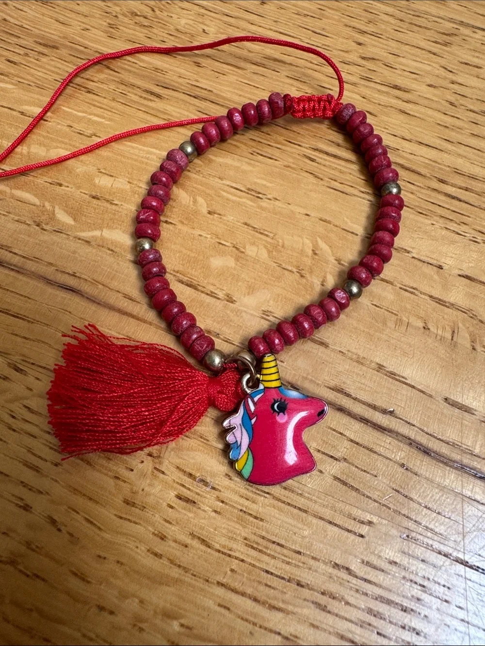 Red Beaded Tassel Bracelet with Unicorn Charm
